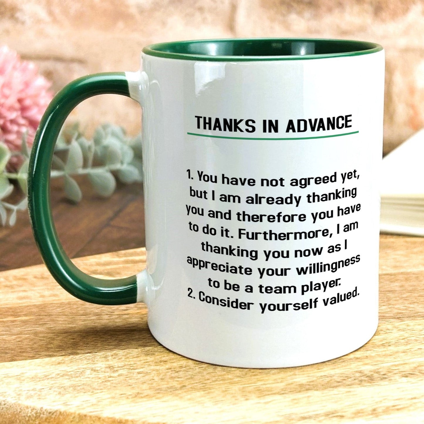 a green and white coffee mug with a poem on it