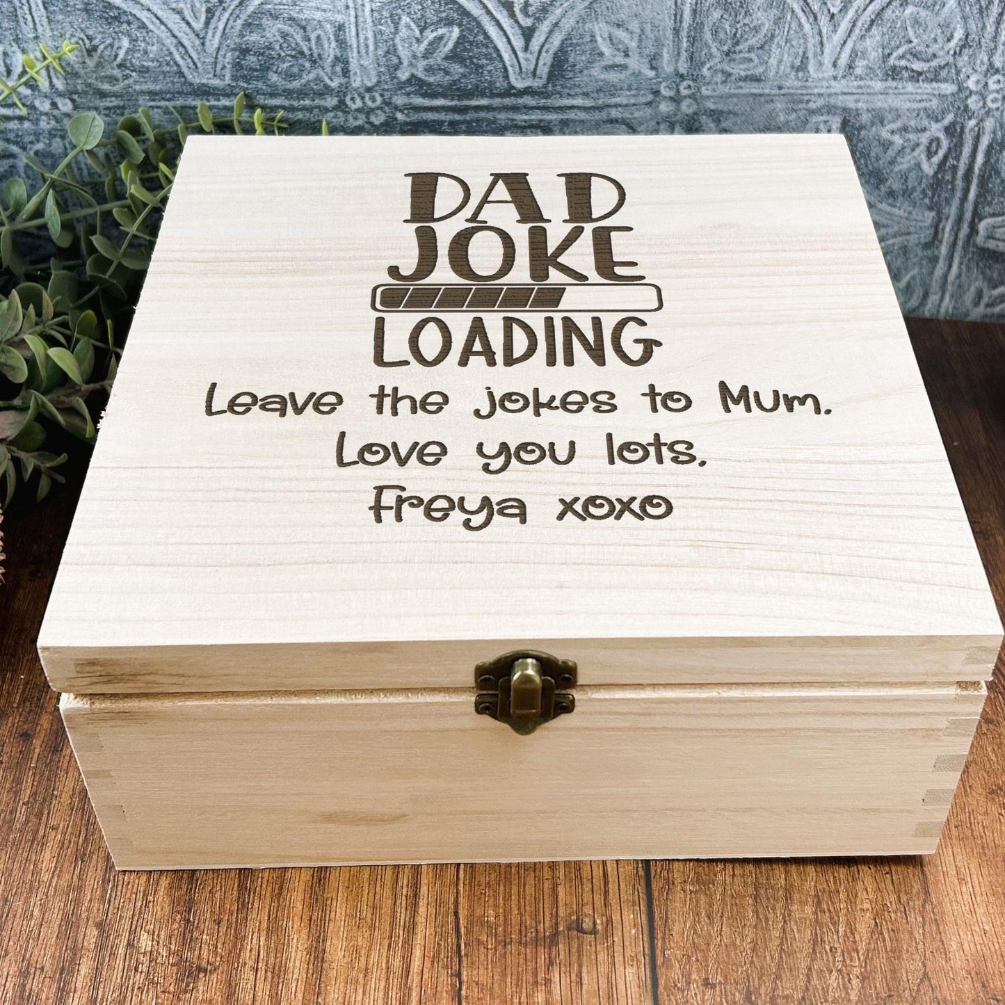 a wooden box sitting on top of a wooden table