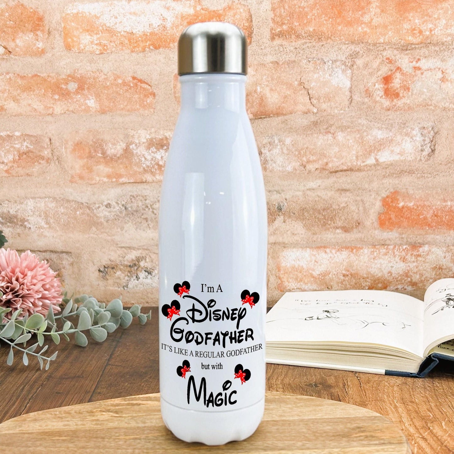 a white water bottle sitting on top of a wooden table