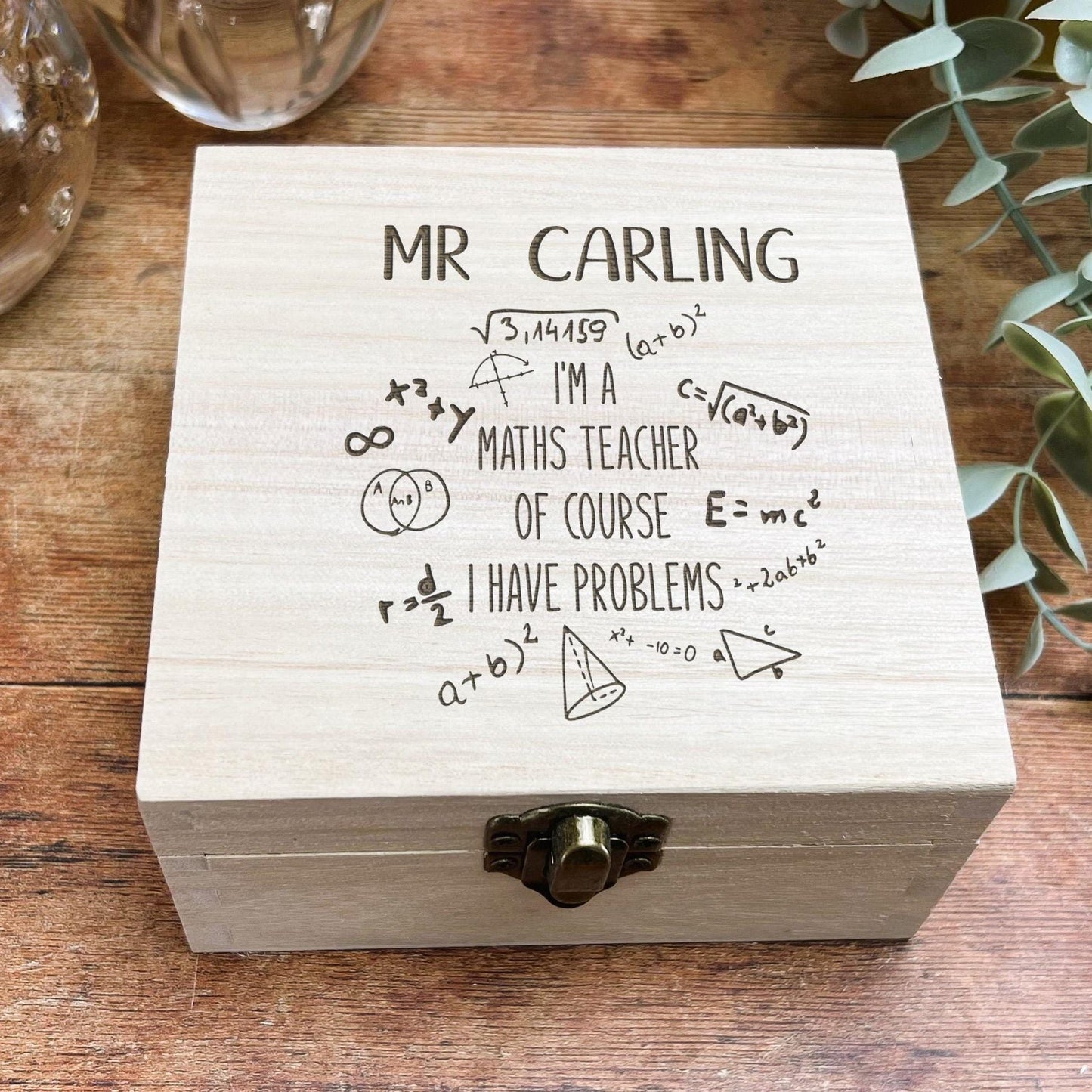 a wooden box sitting on top of a wooden table