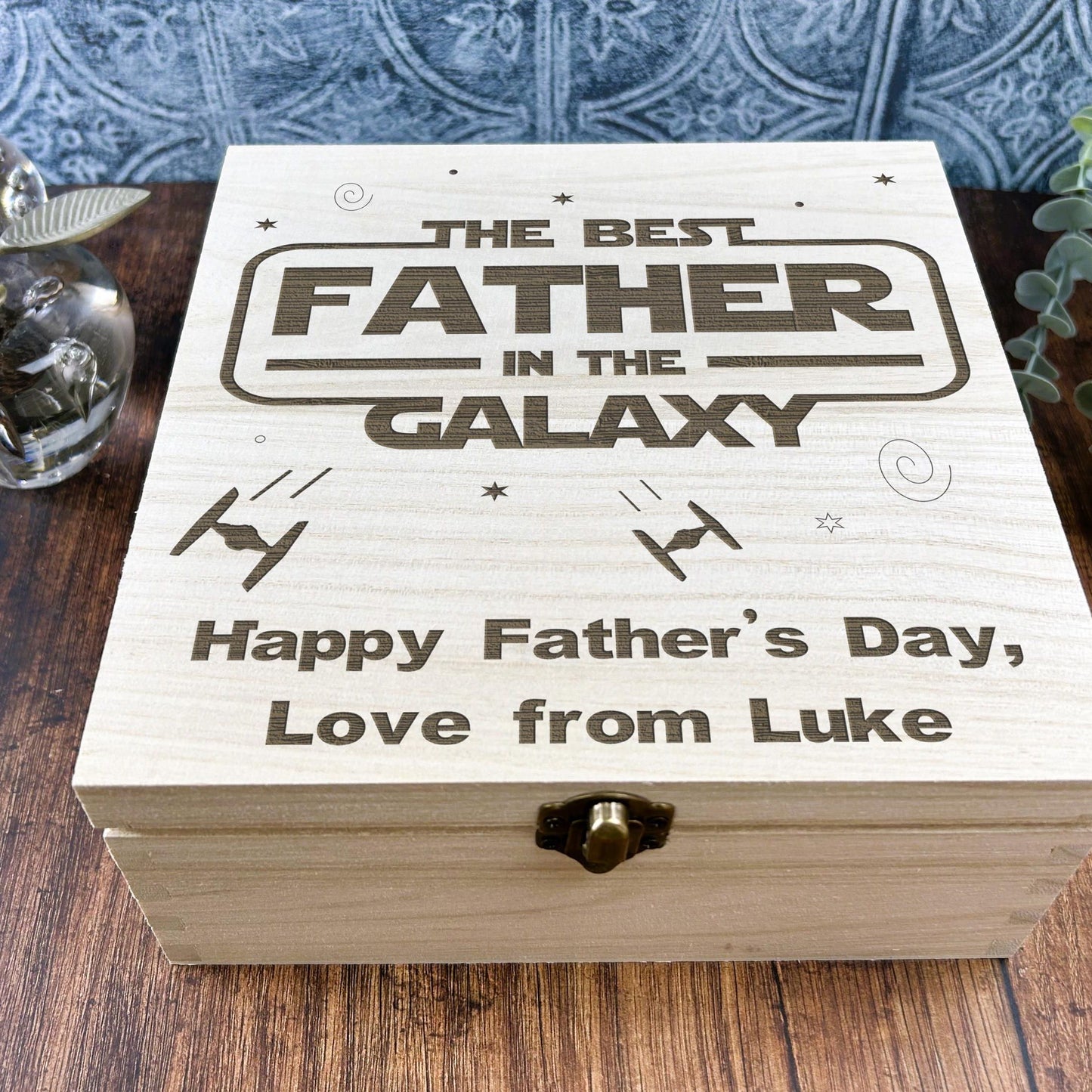 a wooden box sitting on top of a wooden table