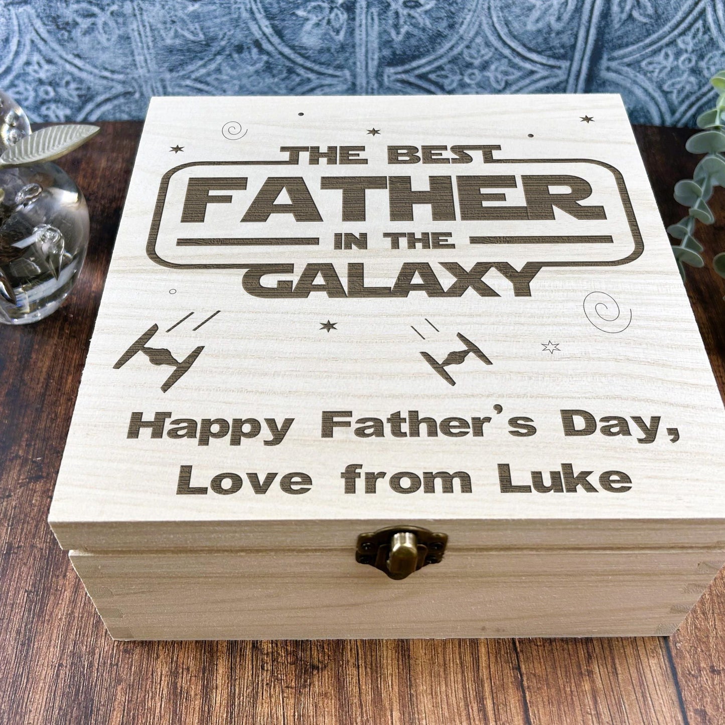 a wooden box sitting on top of a wooden table