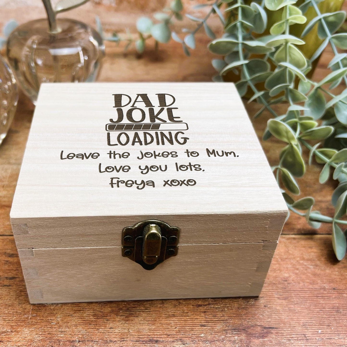 a wooden box sitting on top of a wooden table