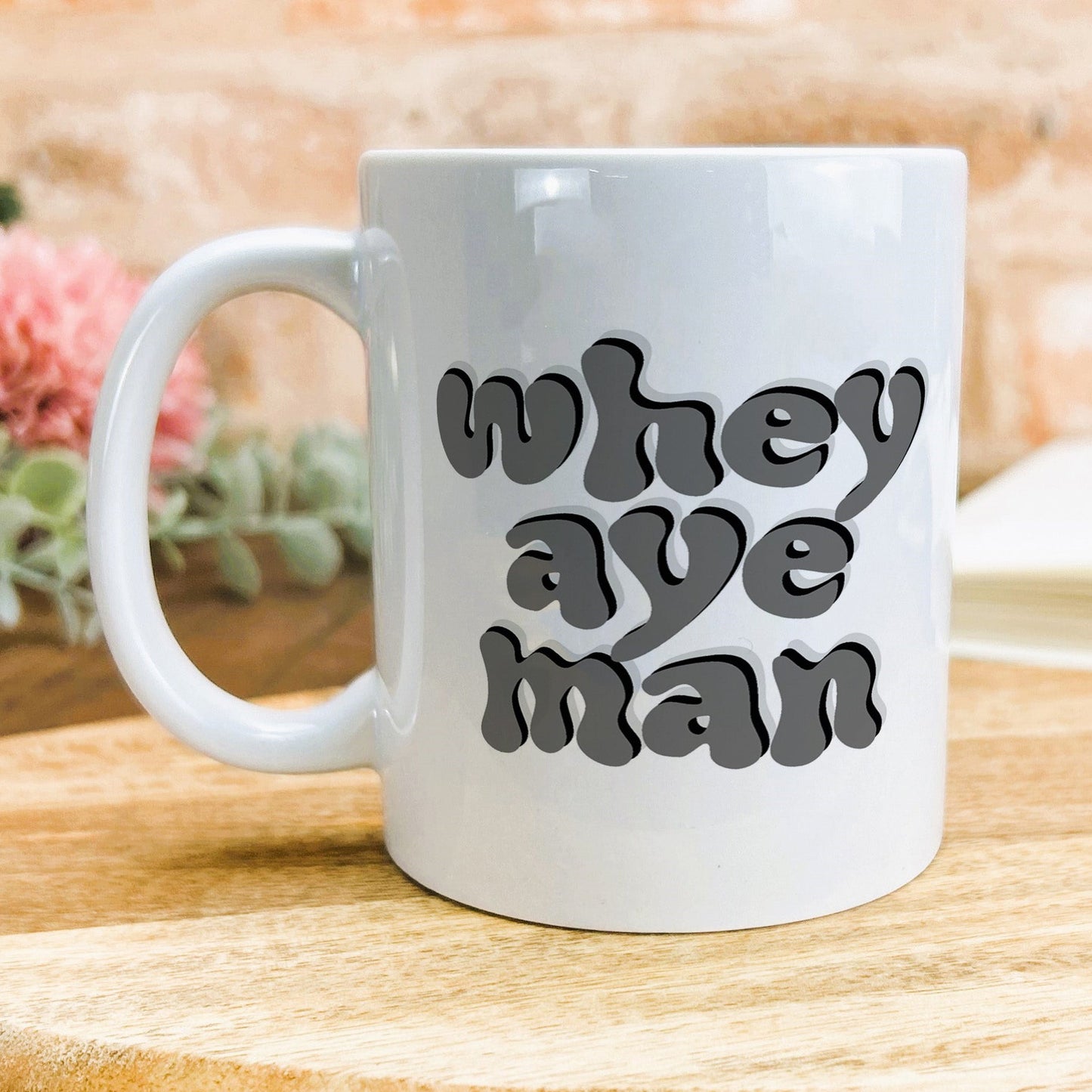 a white coffee mug with the words we are man on it
