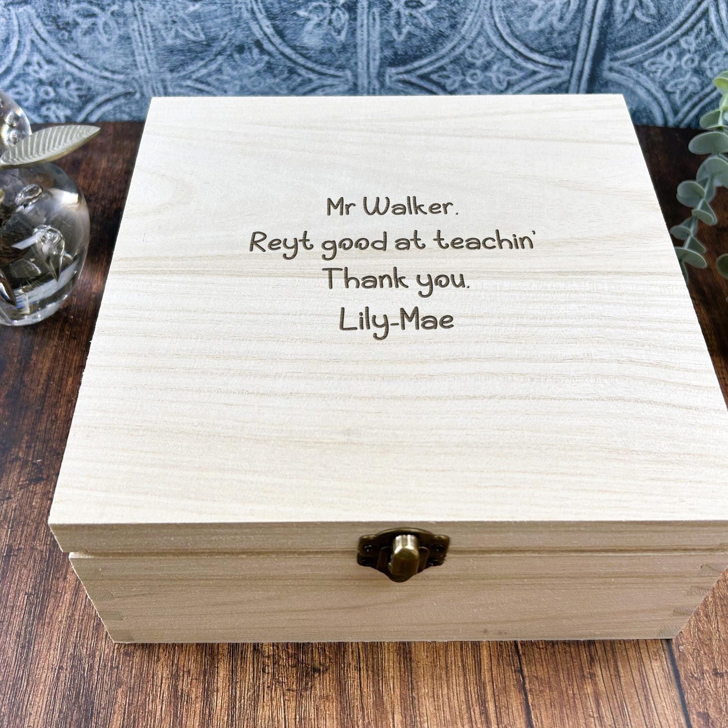 a wooden box with a message written on it