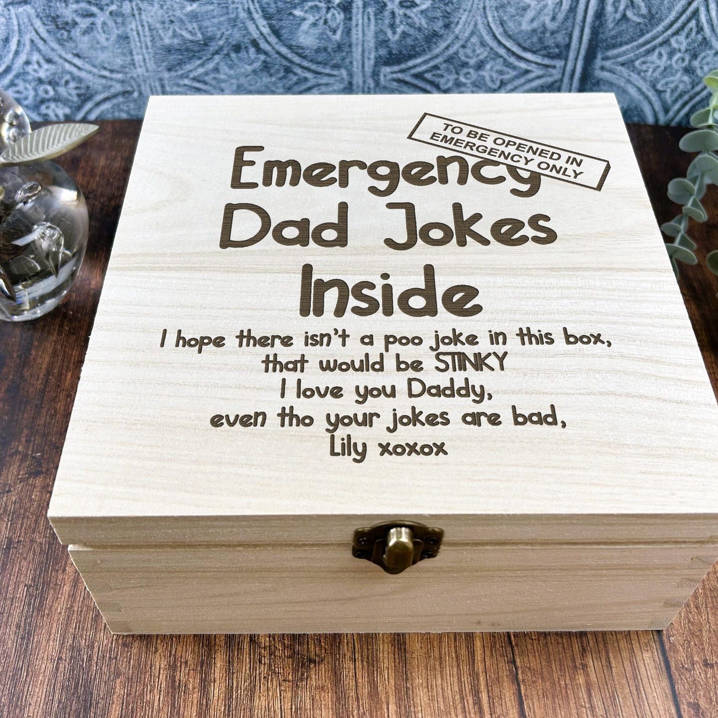 a wooden box sitting on top of a wooden table
