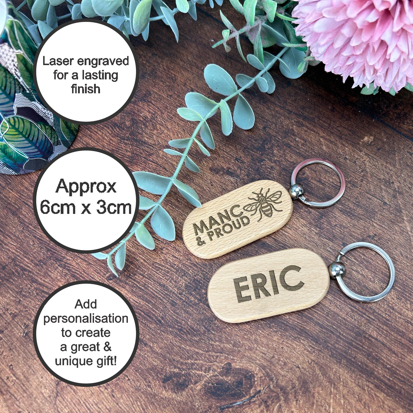 a couple of key chains sitting on top of a wooden table