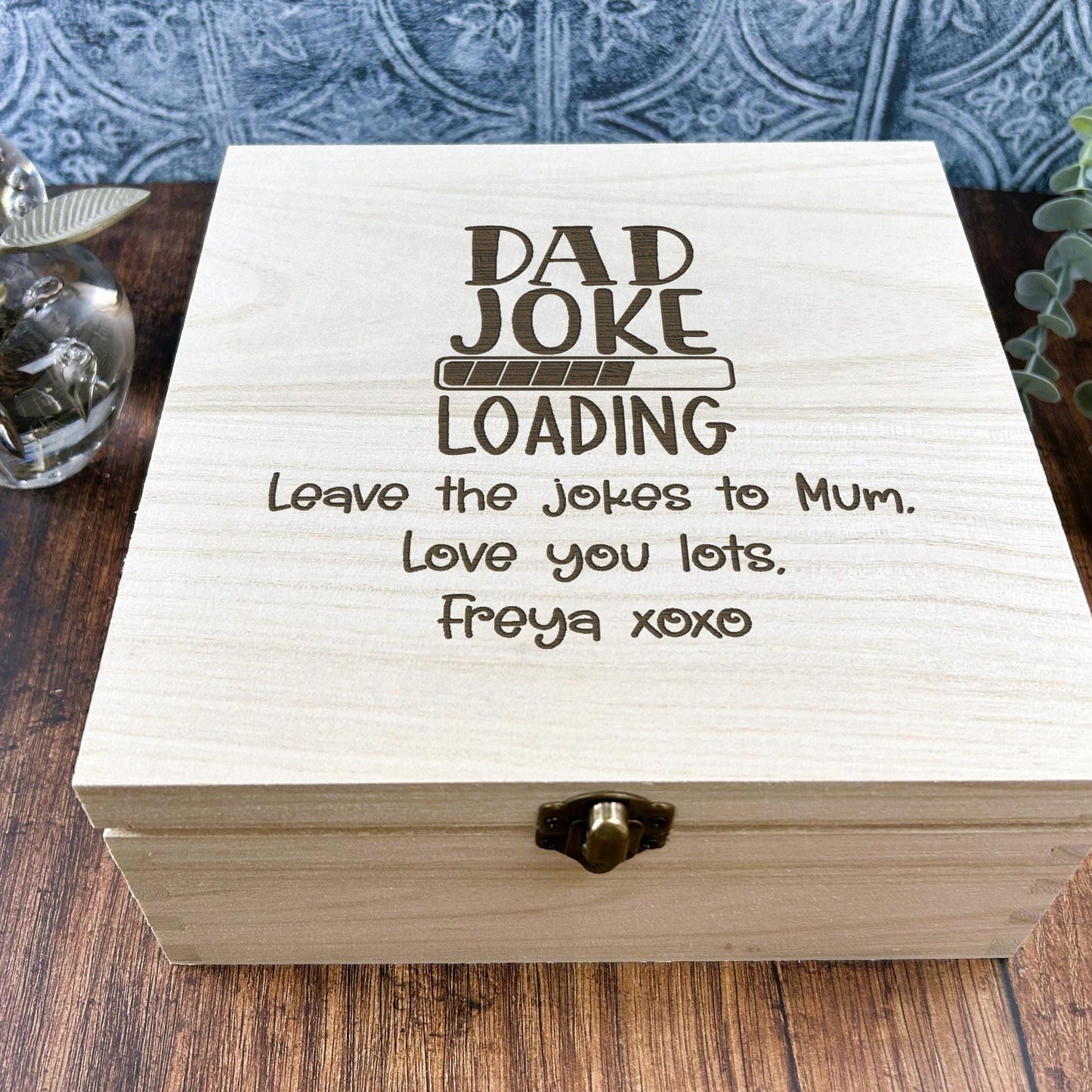 a wooden box sitting on top of a wooden table