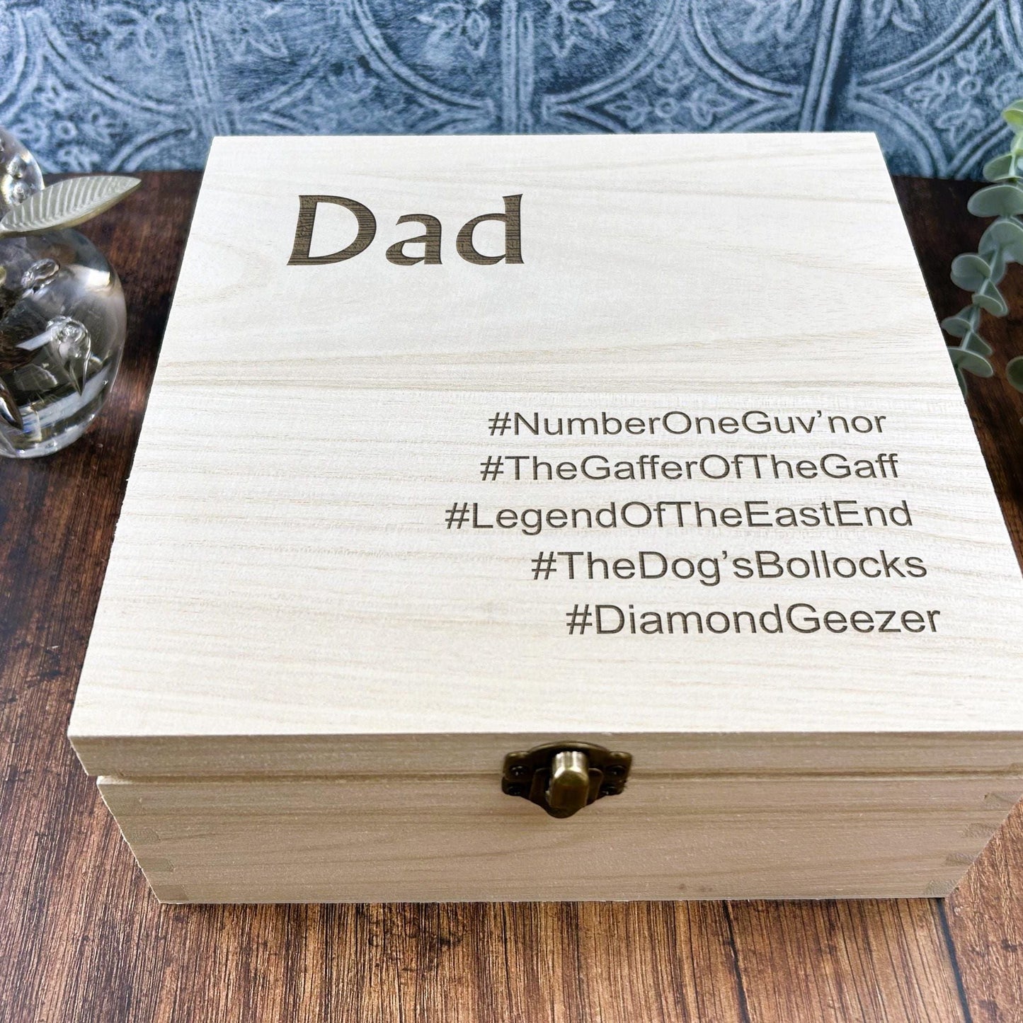 a wooden box sitting on top of a wooden table