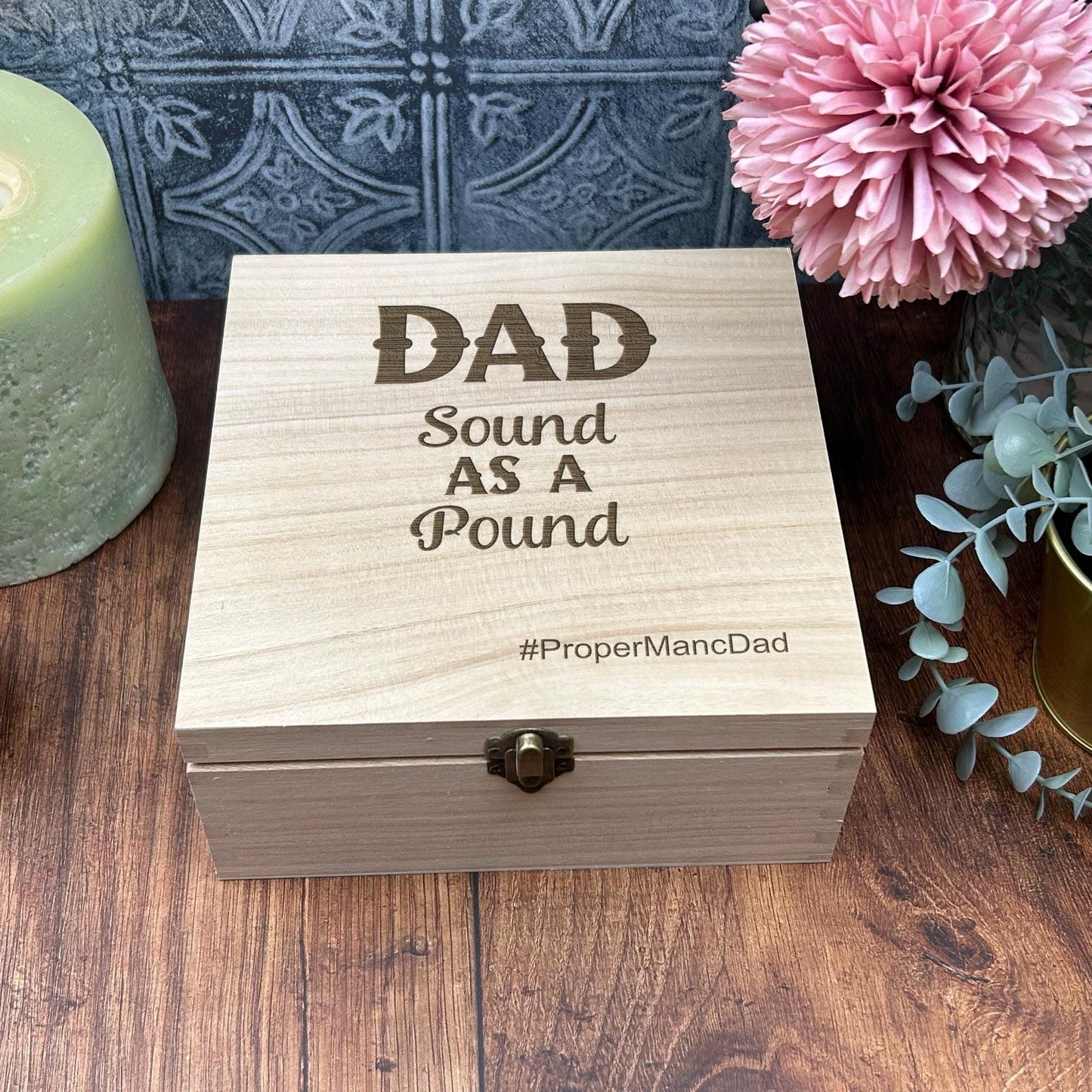 a wooden box sitting on top of a wooden table