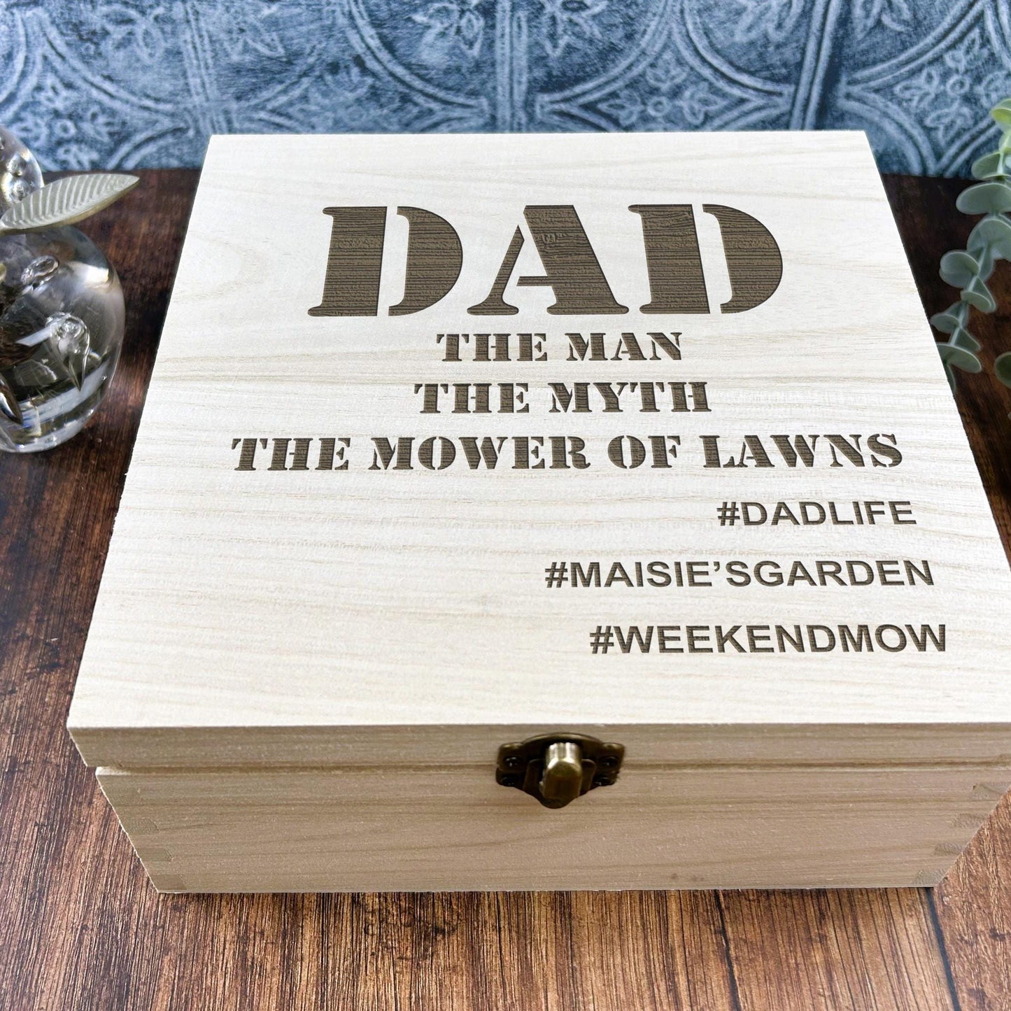 a wooden box sitting on top of a wooden table