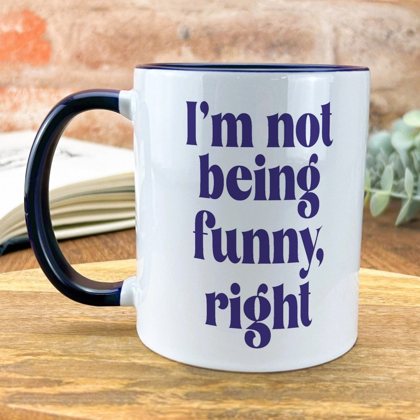 a black and white coffee mug with the words i'm not being funny,