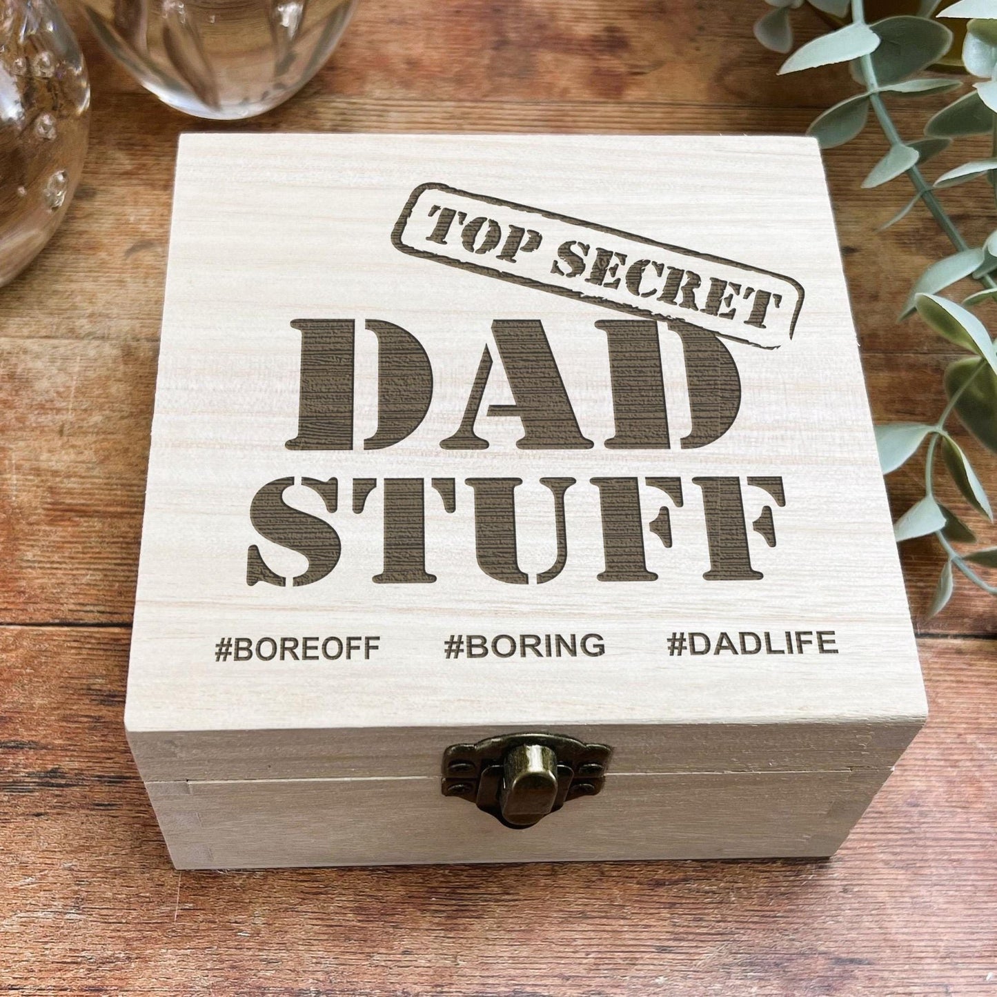 a wooden box sitting on top of a wooden table