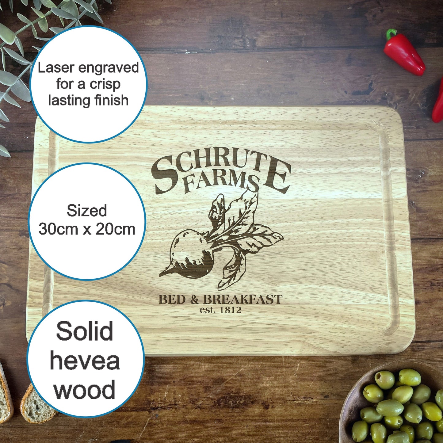 a cutting board with olives and a bowl of bread