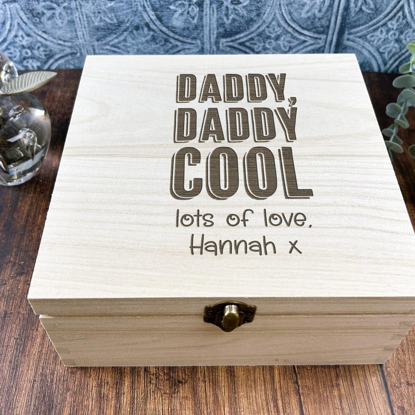 a wooden box sitting on top of a wooden table
