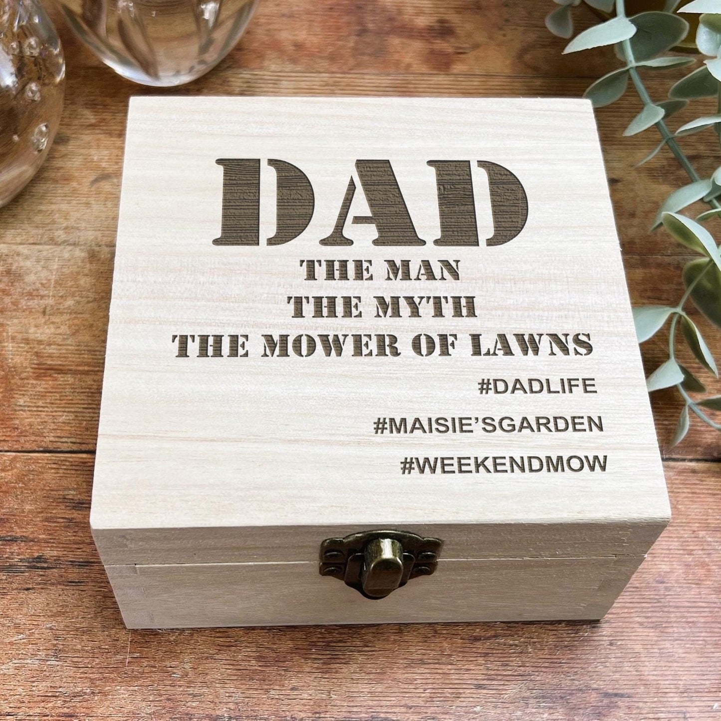 a wooden box sitting on top of a wooden table