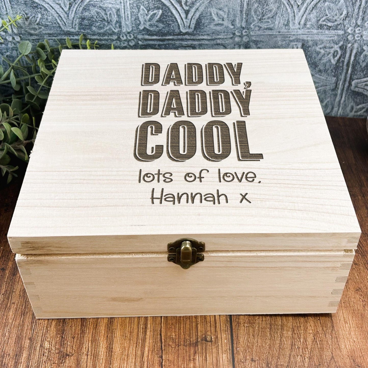 a wooden box sitting on top of a wooden table