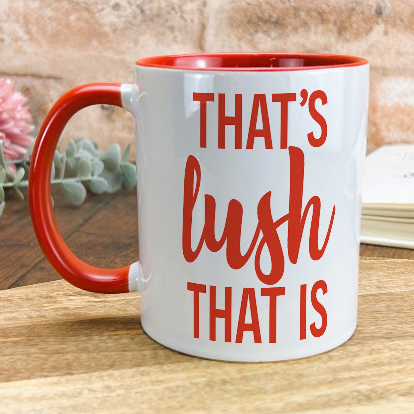 a red and white coffee mug that says that's bush that is