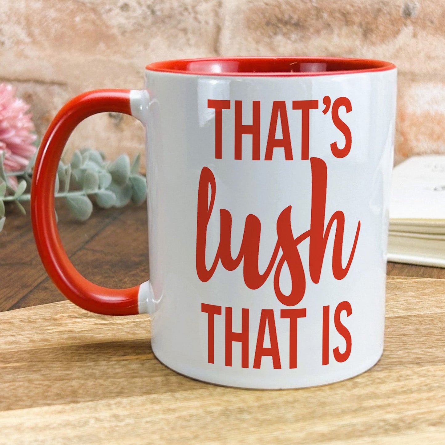 a red and white coffee mug that says that's bush that is