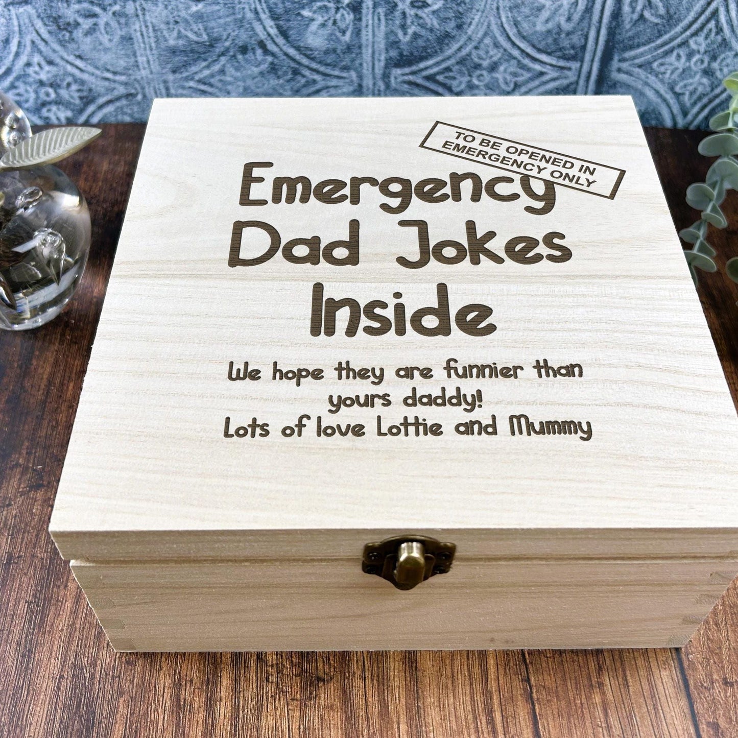 a wooden box sitting on top of a wooden table