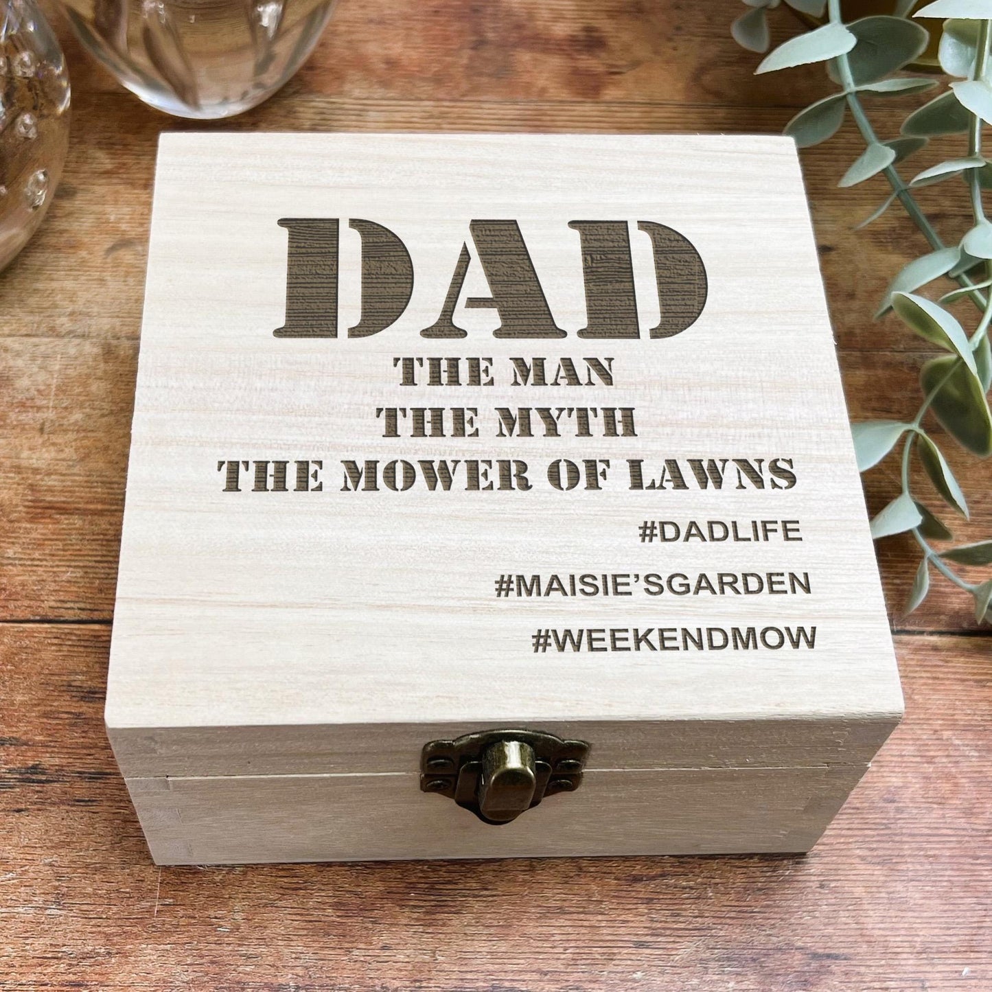 a wooden box sitting on top of a wooden table