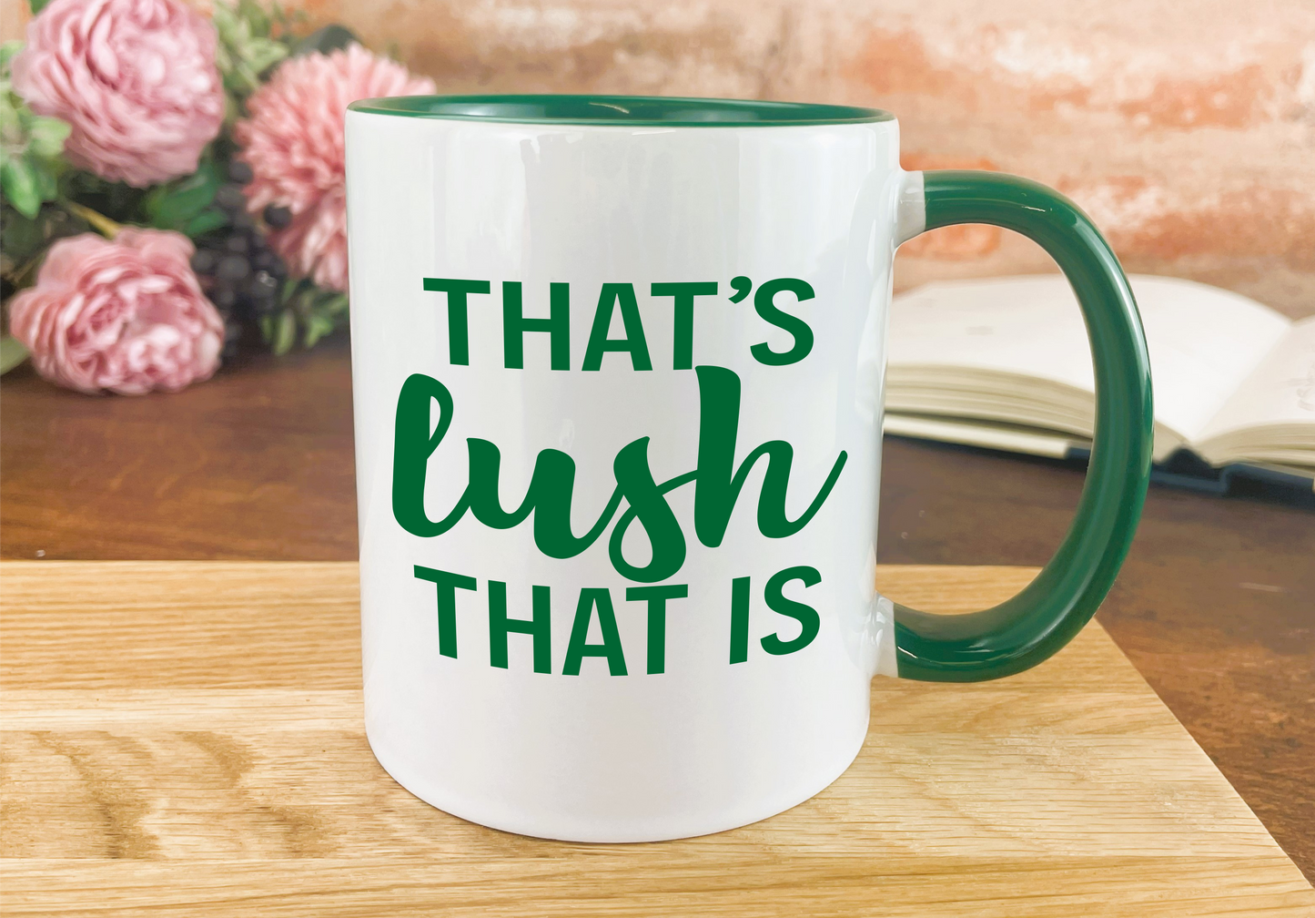 a green and white coffee mug that says that's lush that is