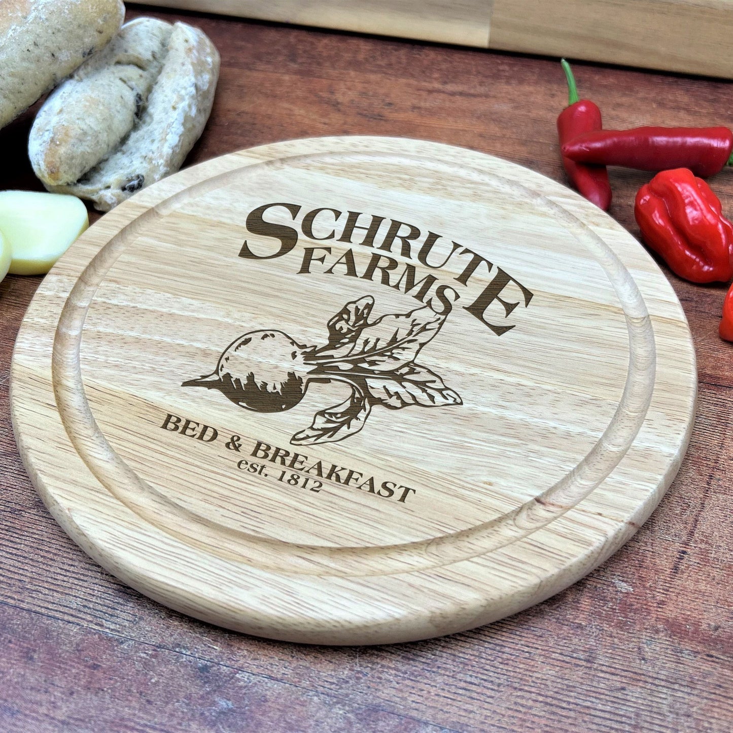 a wooden cutting board with a logo on it
