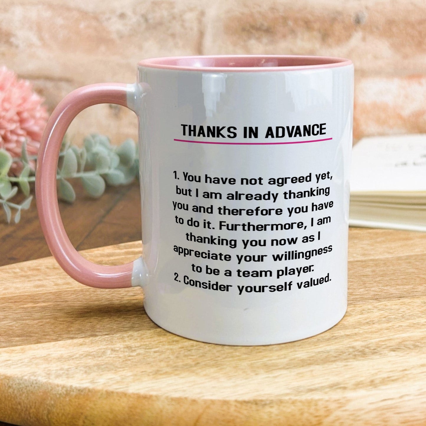 a pink and white coffee mug with a poem on it