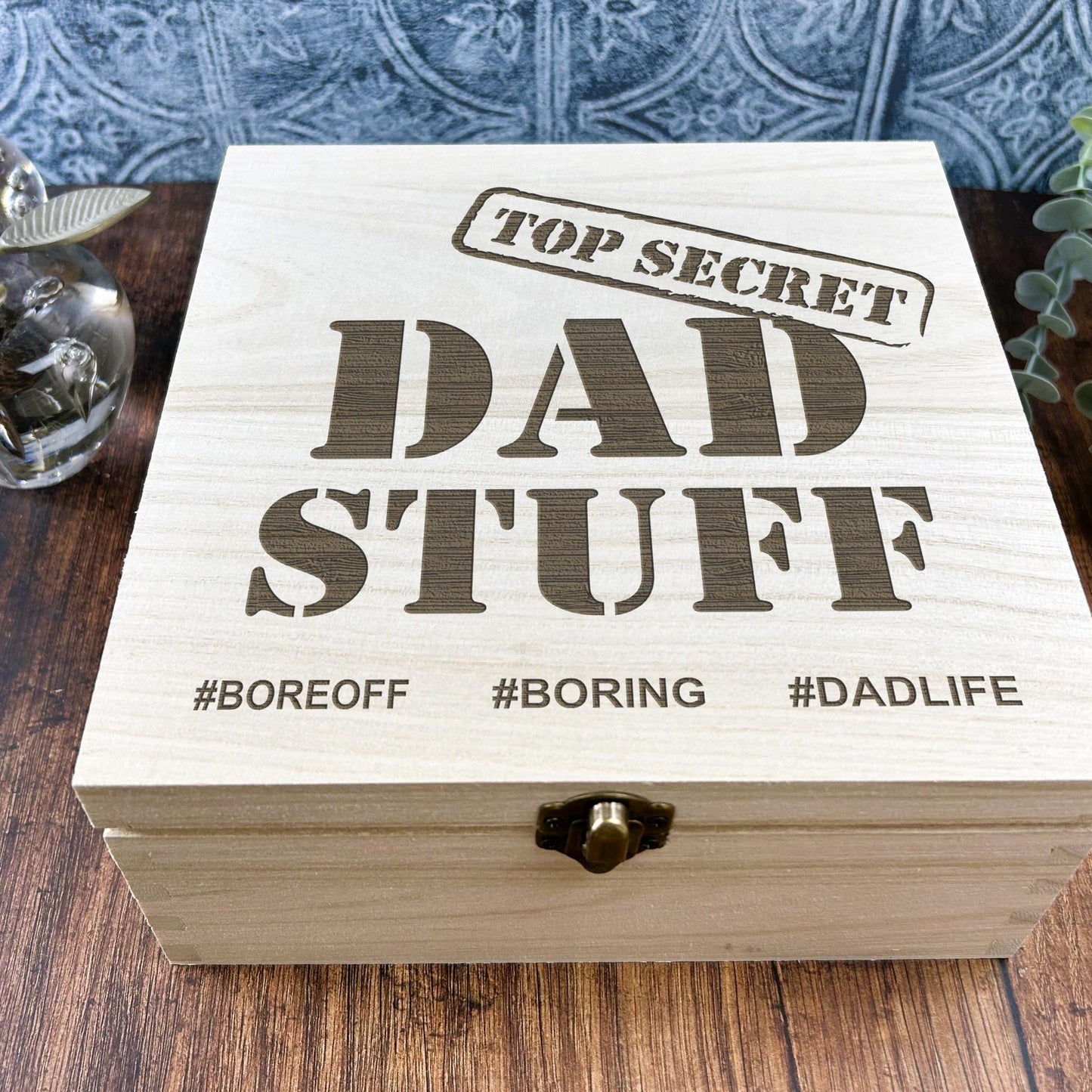a wooden box sitting on top of a wooden table