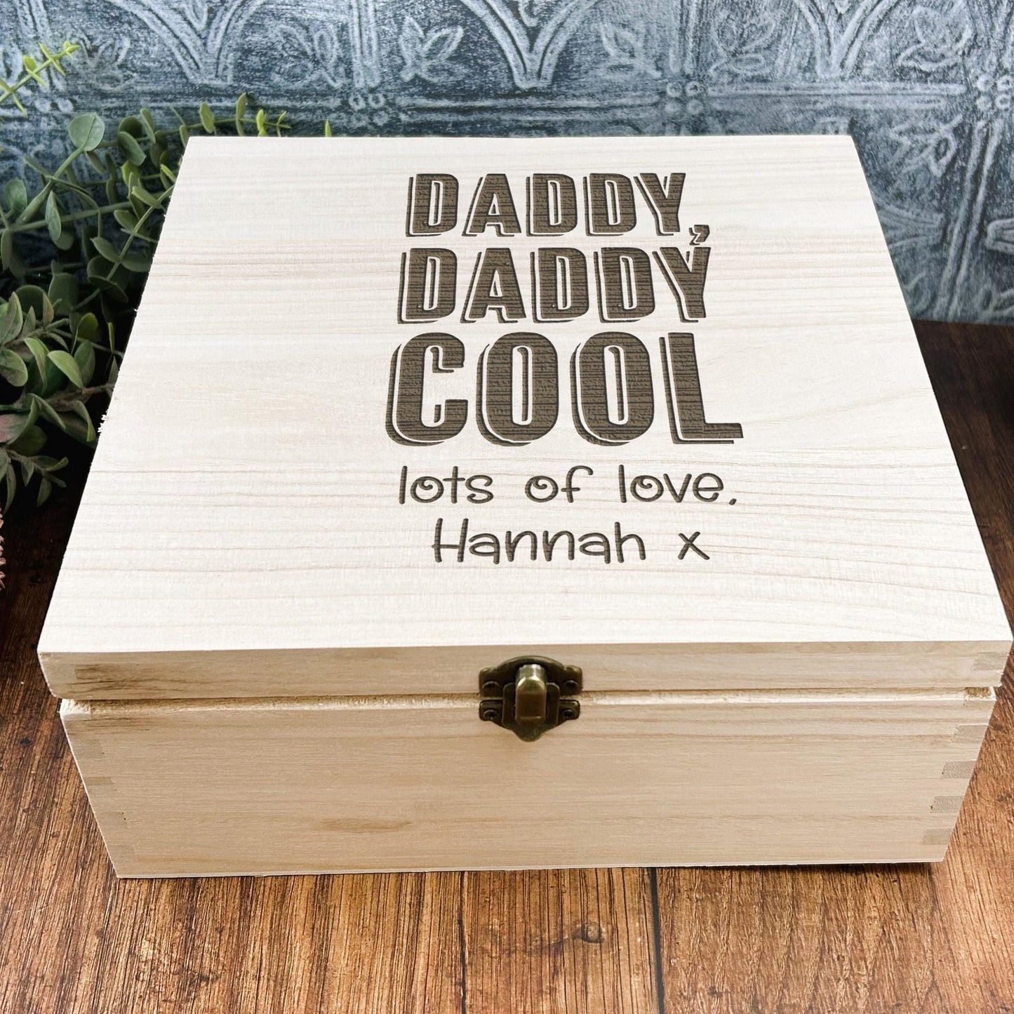 a wooden box sitting on top of a wooden table