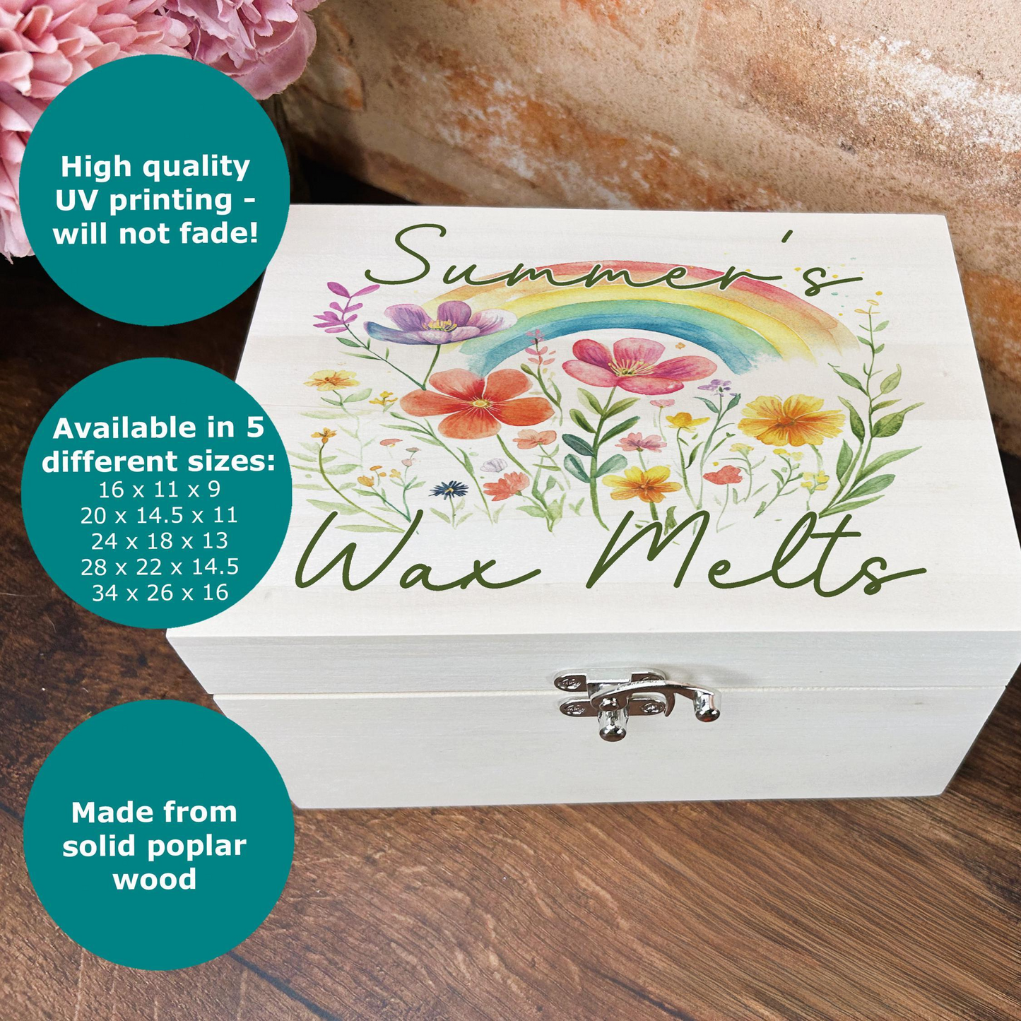 a wooden box with a picture of a rainbow and flowers on it