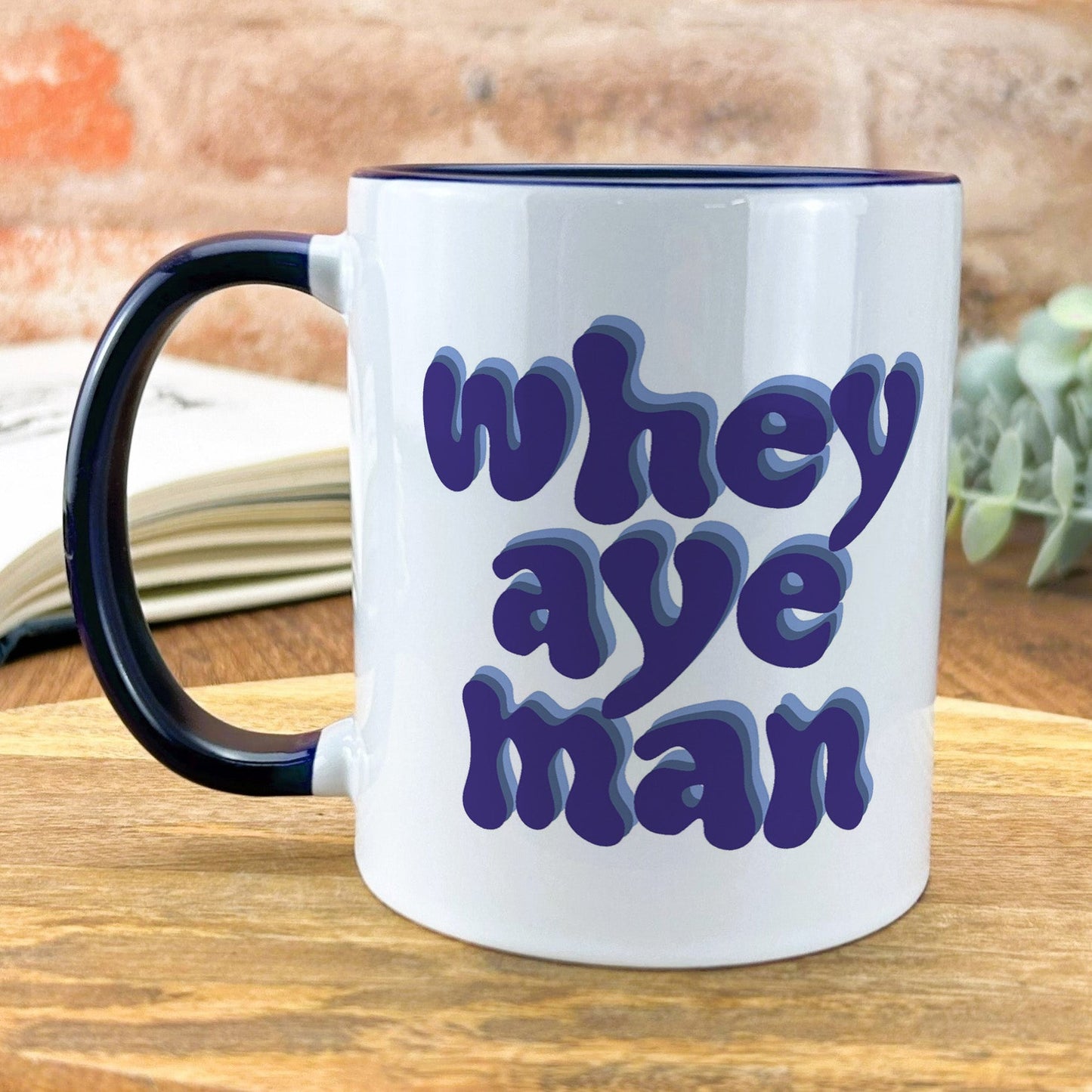 a white and black coffee mug with the words'why aye man'printed on