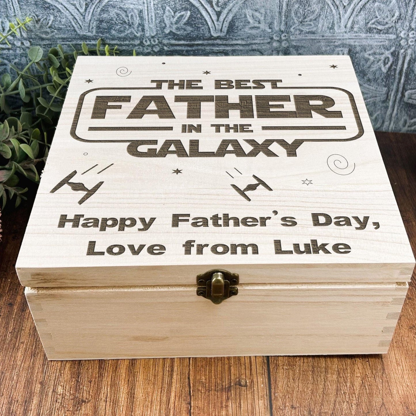 a wooden box sitting on top of a wooden table