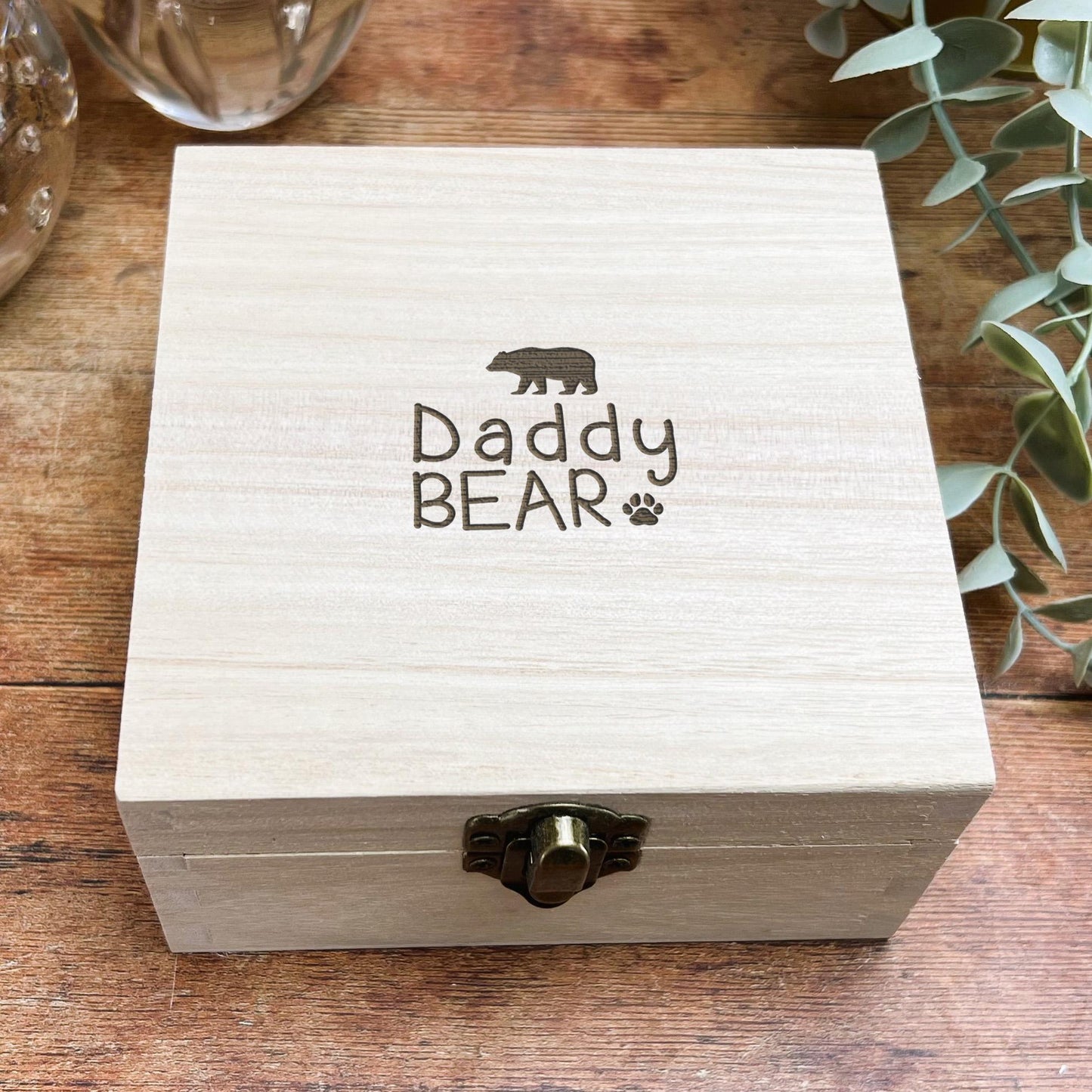 a wooden box sitting on top of a wooden table