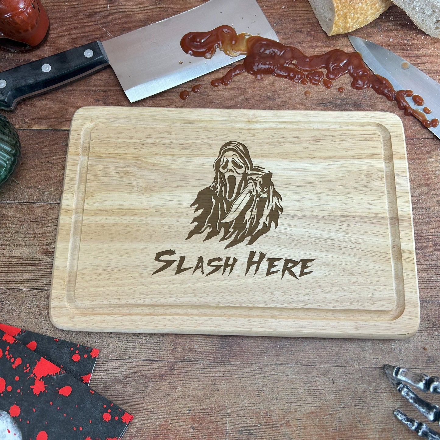 a wooden cutting board with a picture of a ghost on it