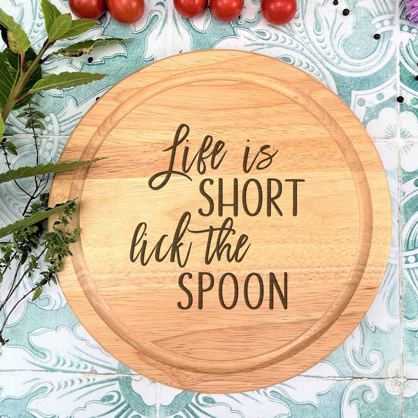 a wooden sign that says life is short like the spoon