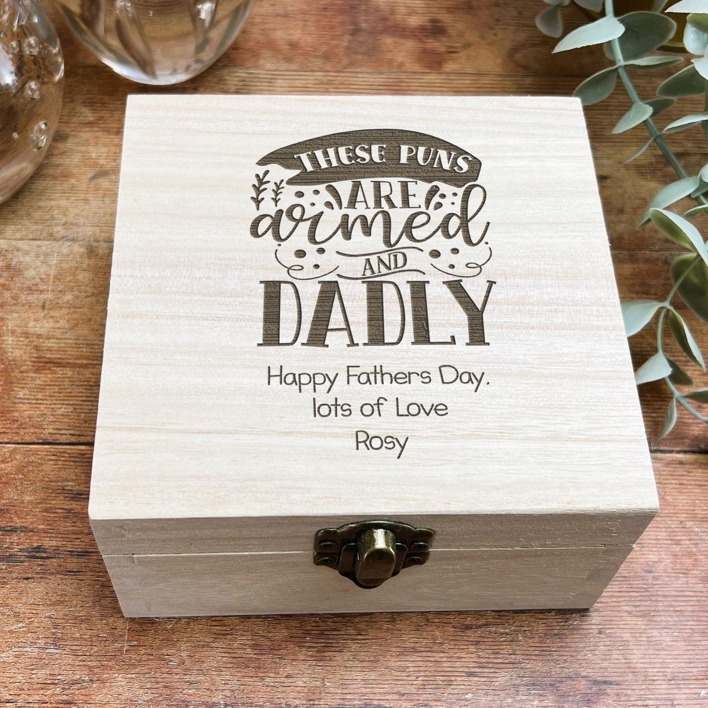 a wooden box sitting on top of a wooden table