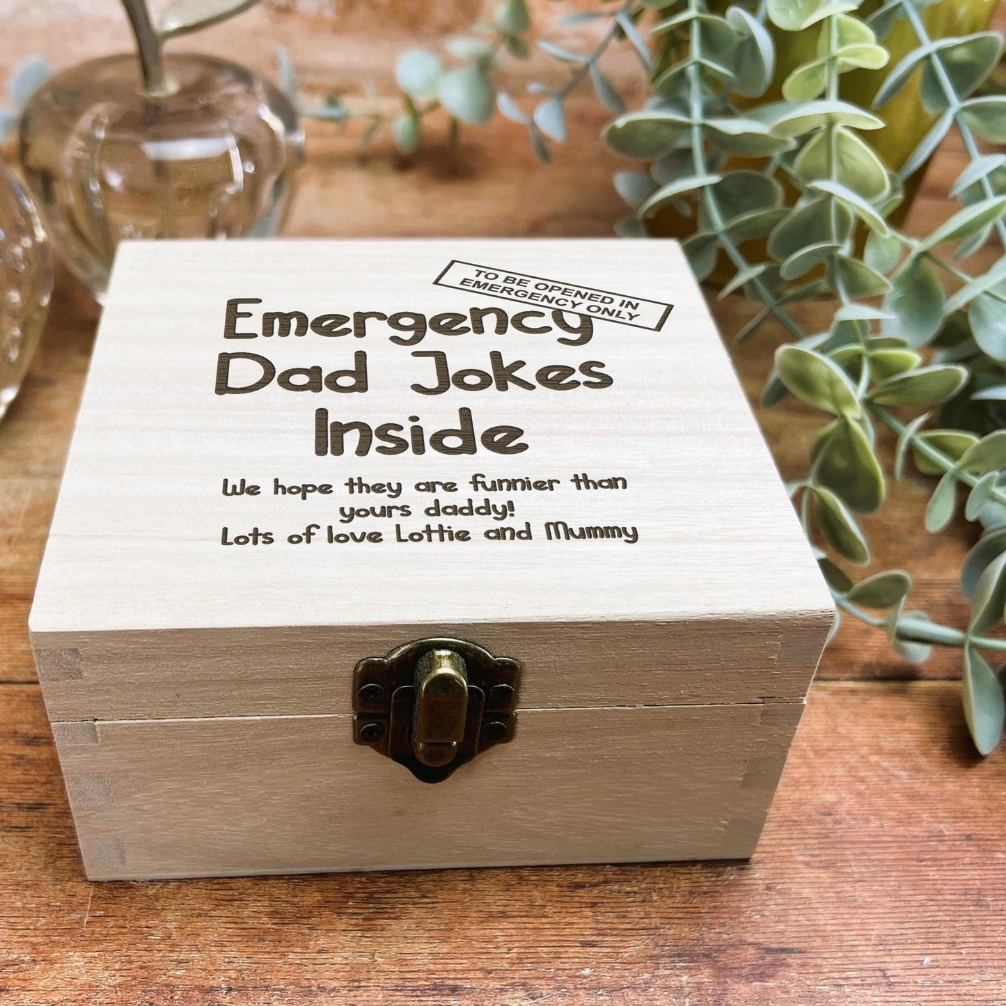 a wooden box sitting on top of a wooden table