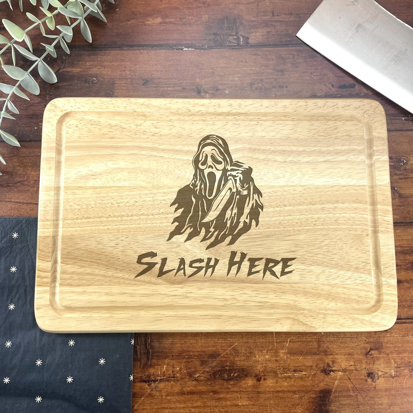 a wooden cutting board with a picture of a man on it