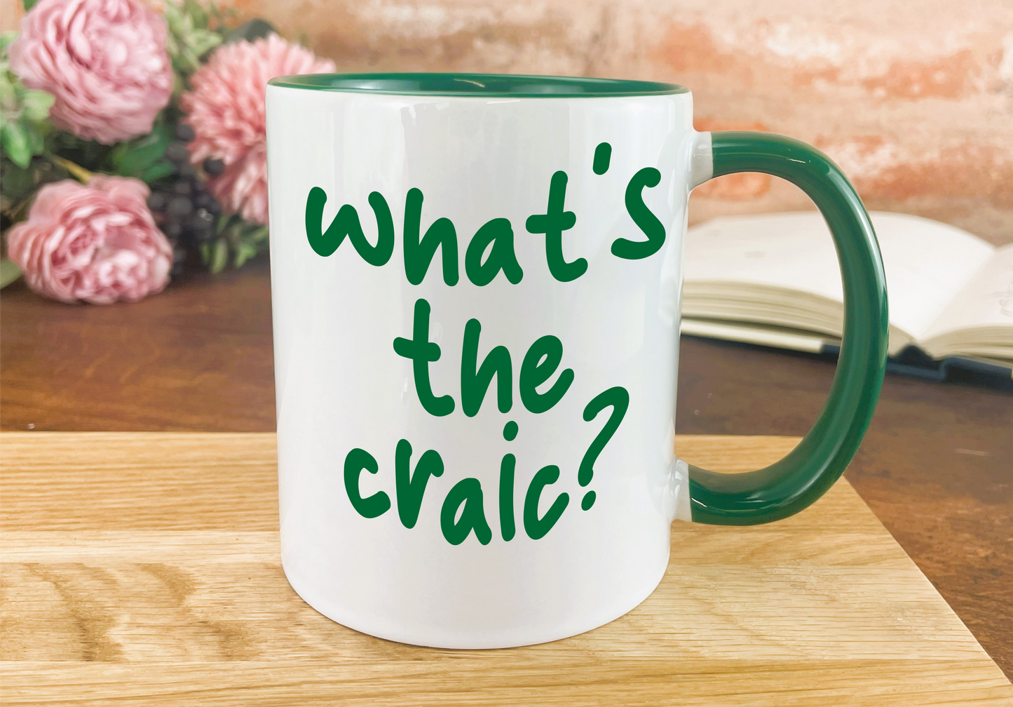 a green and white coffee mug with the words what's the crai?