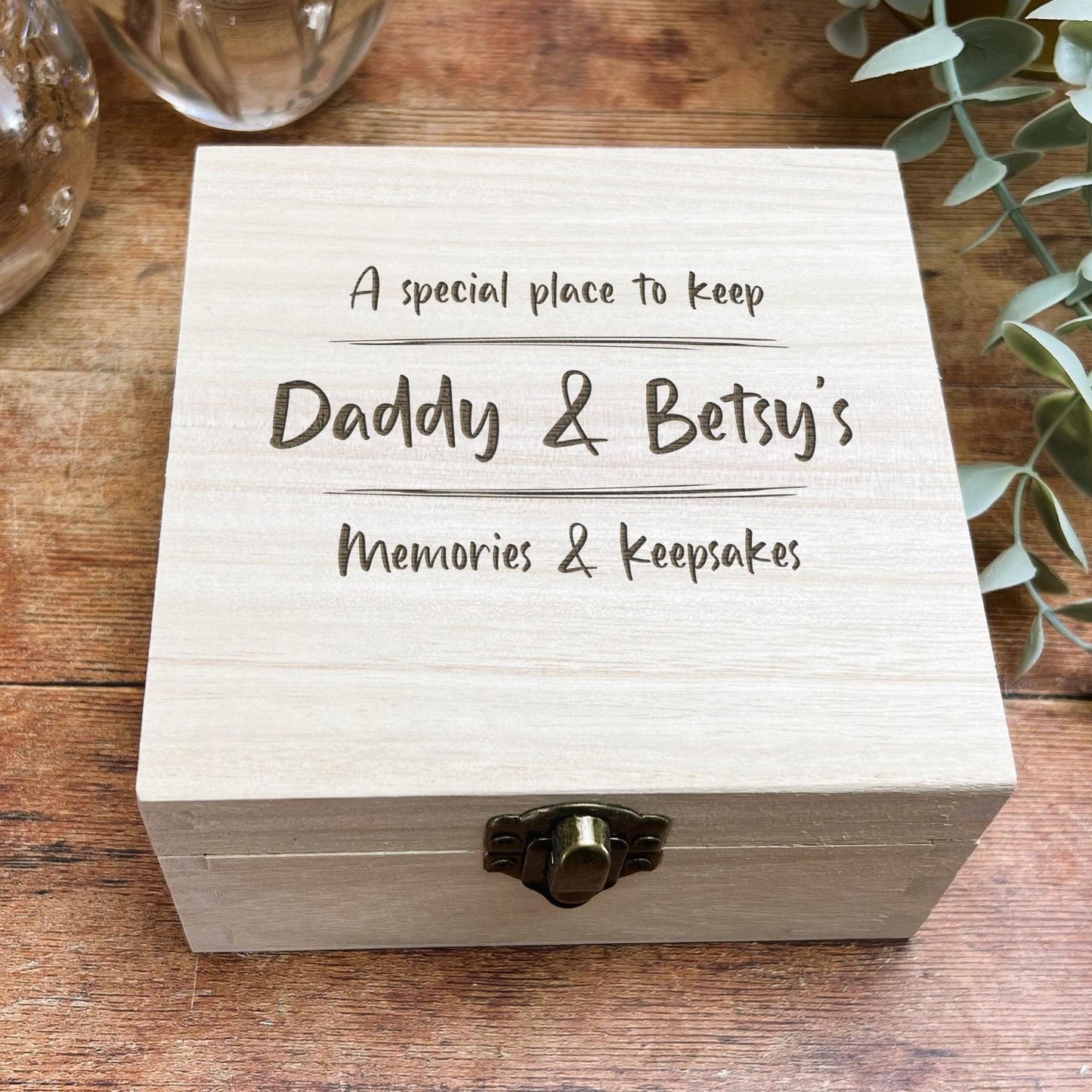 a wooden box sitting on top of a wooden table