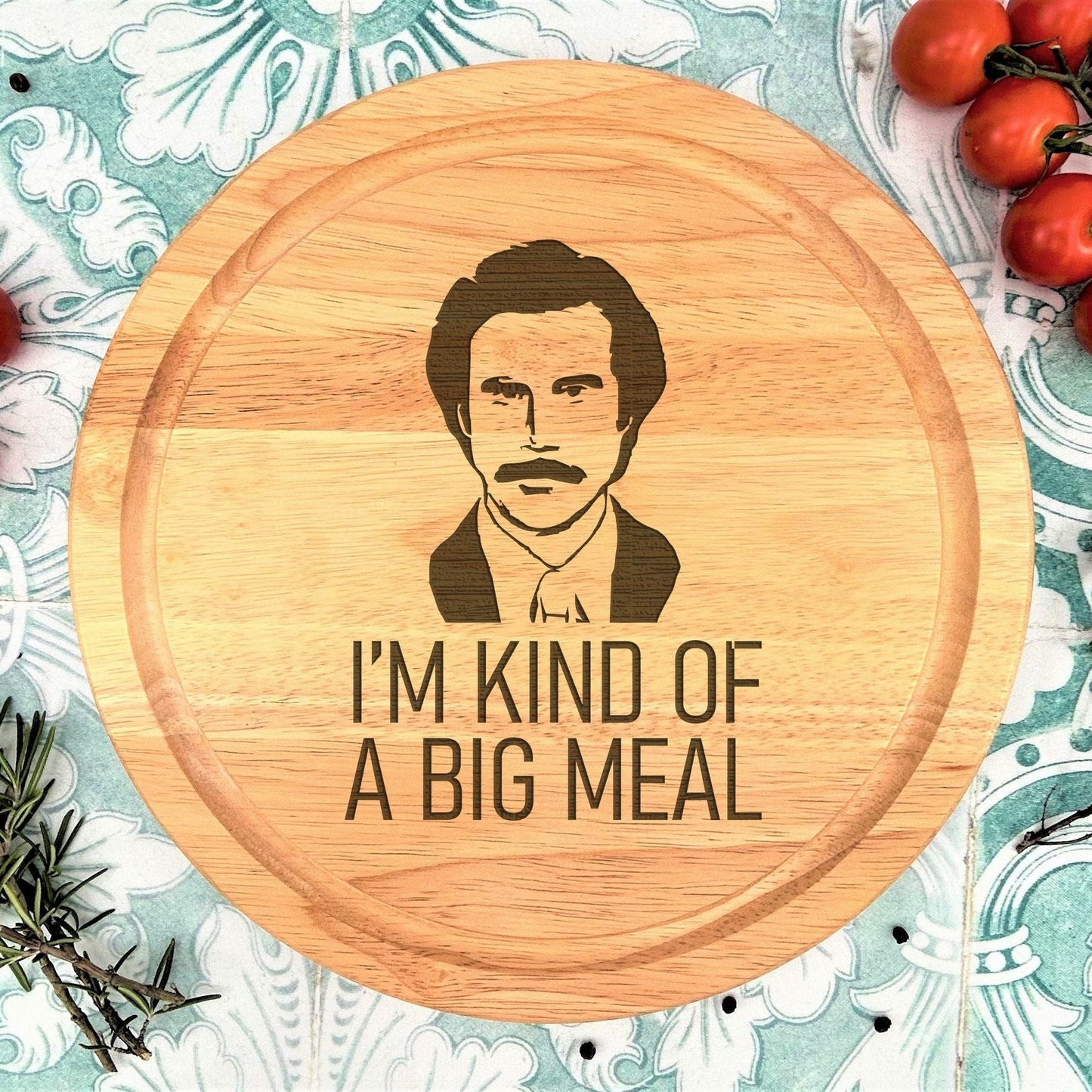 a wooden cutting board with a picture of a man on it