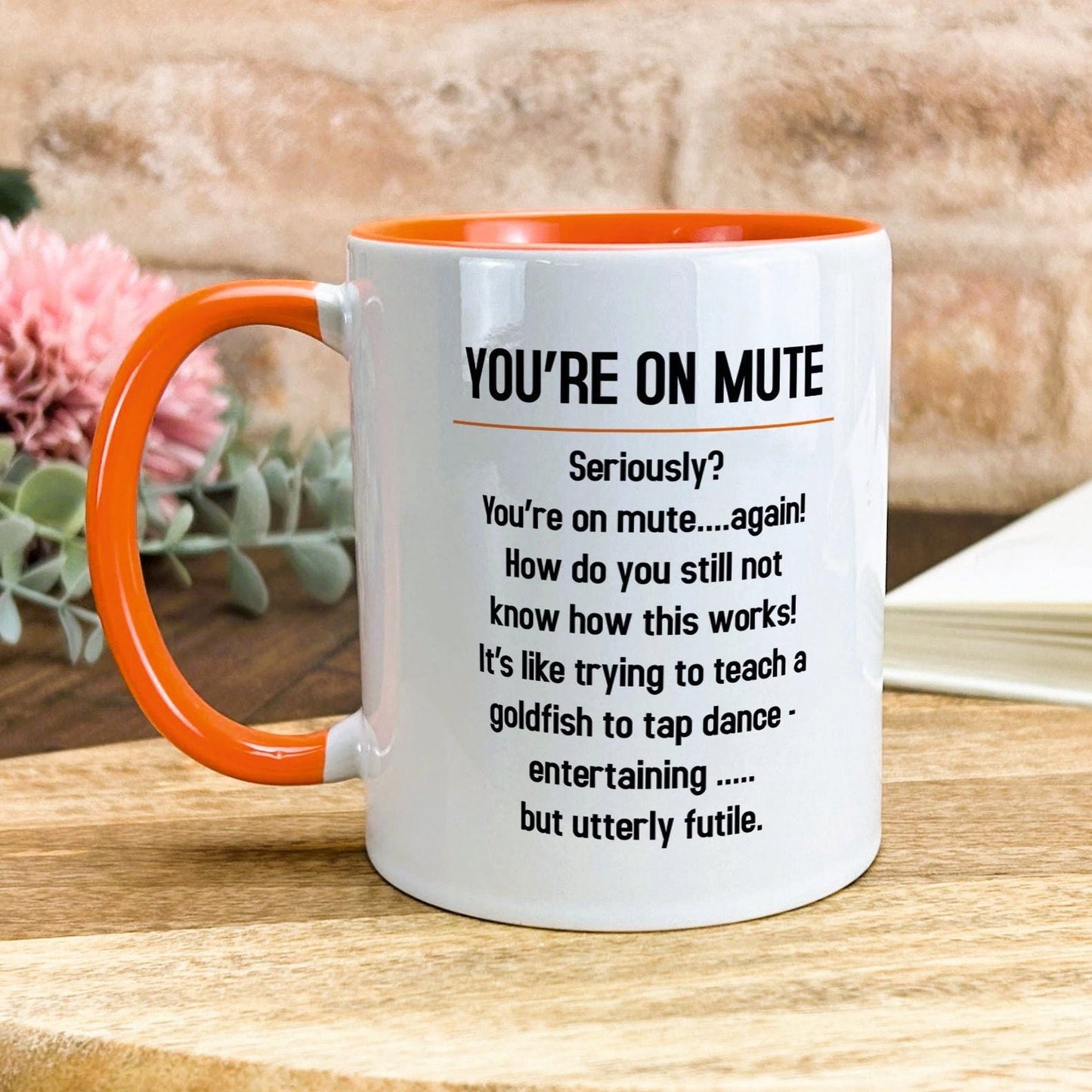 a white and orange coffee mug with a poem on it