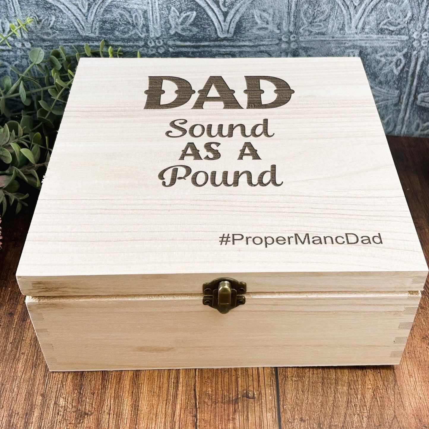 a wooden box sitting on top of a wooden table