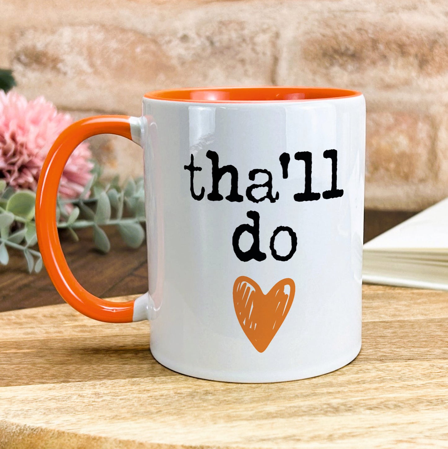 a coffee mug that says thal do with a heart on it