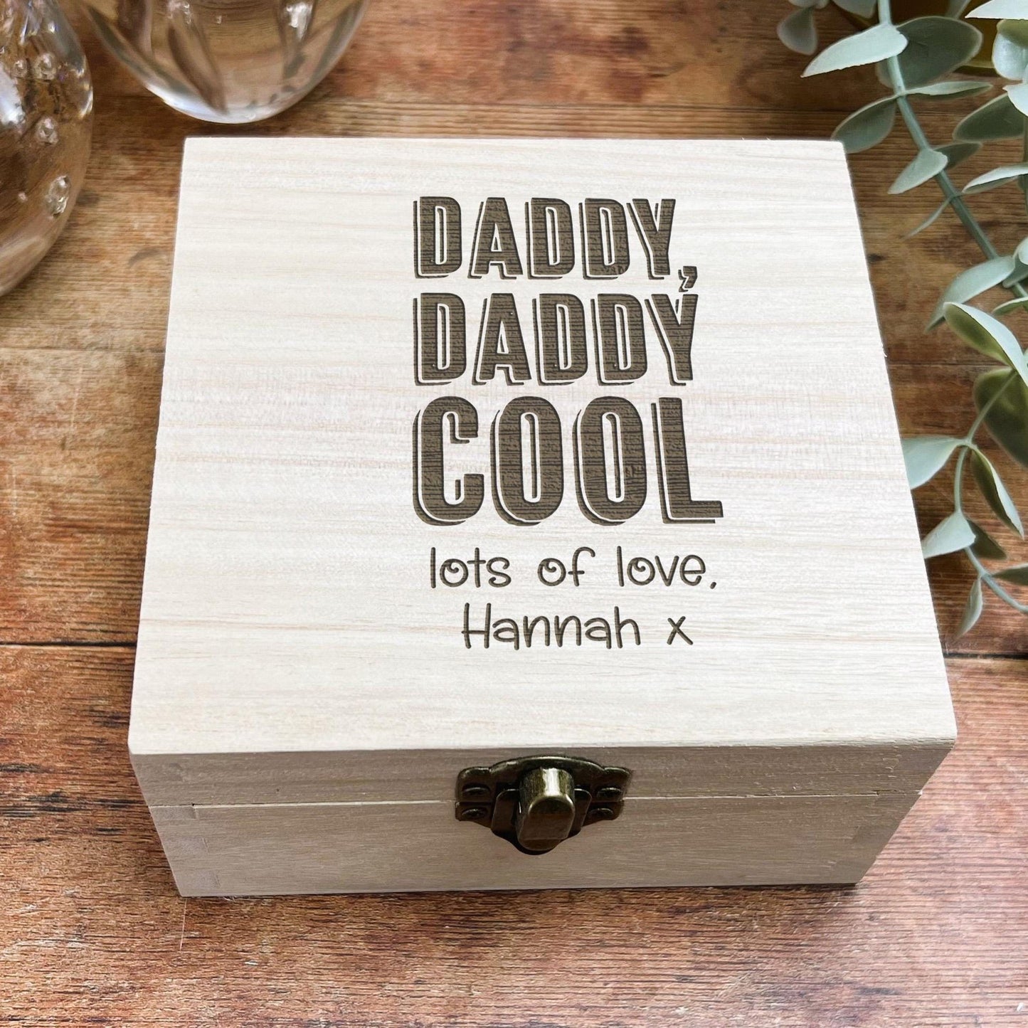 a wooden box sitting on top of a wooden table