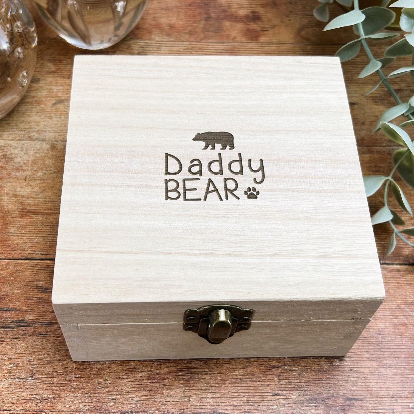 a wooden box sitting on top of a wooden table