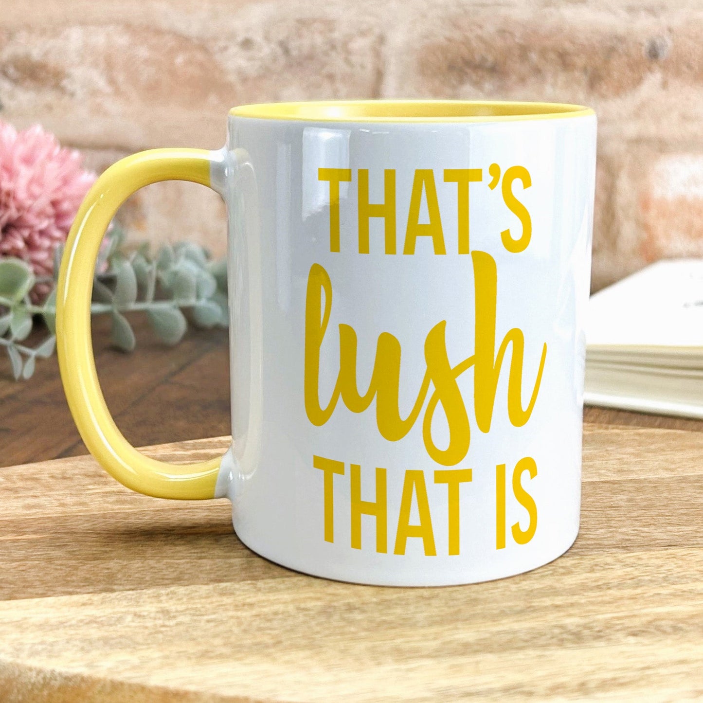 a yellow and white coffee mug that says that's bush that is