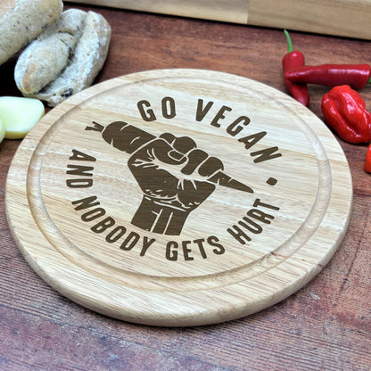 a wooden cutting board with a picture of a fist on it