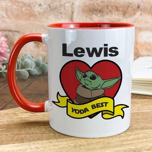 A red and white mug with a cartoon image of a young alien character, likely representing Yoda from the Star Wars franchise, and the text "Lewis YODA BEST" printed on it.